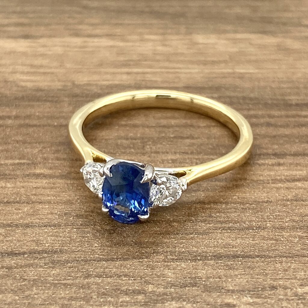 Gold ring with sapphire and diamonds.