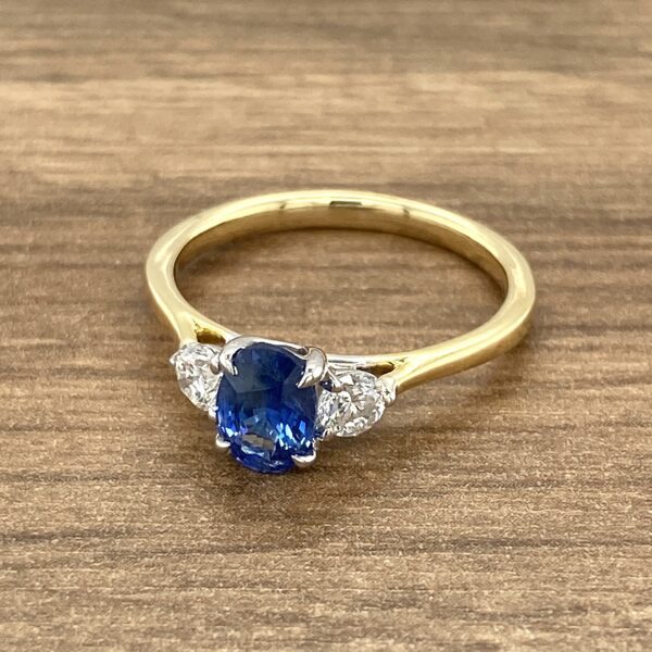 Gold ring with sapphire and diamonds.