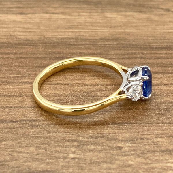 Gold ring with sapphire and diamonds.