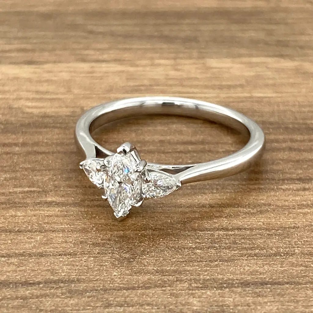 Three-stone marquise diamond engagement ring.