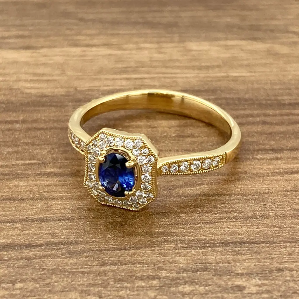 Gold ring with sapphire and diamonds.