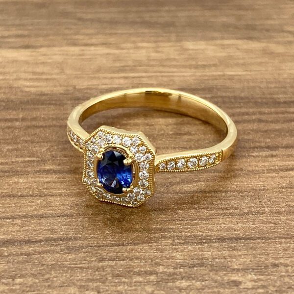 Gold ring with sapphire and diamonds.
