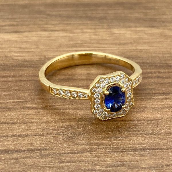 Gold ring with blue sapphire and diamonds.