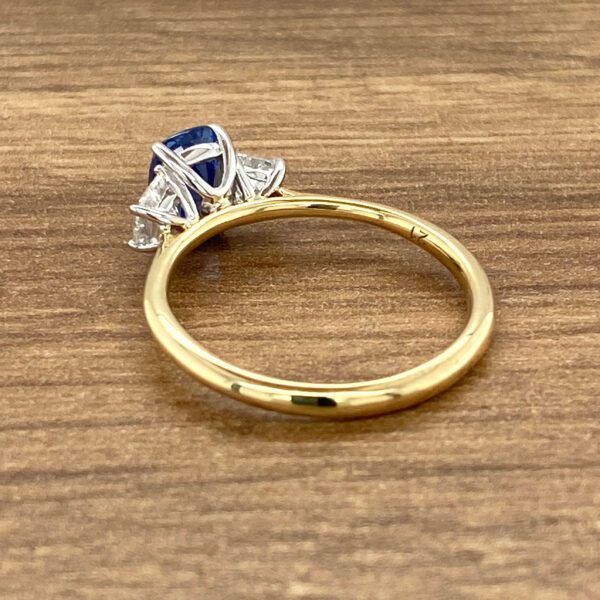 Gold ring with sapphire and diamonds.