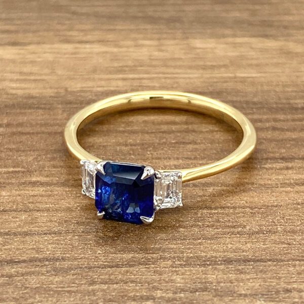 Gold ring with sapphire and diamonds.