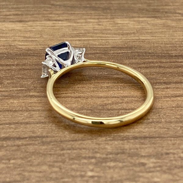 Gold three-stone sapphire ring.