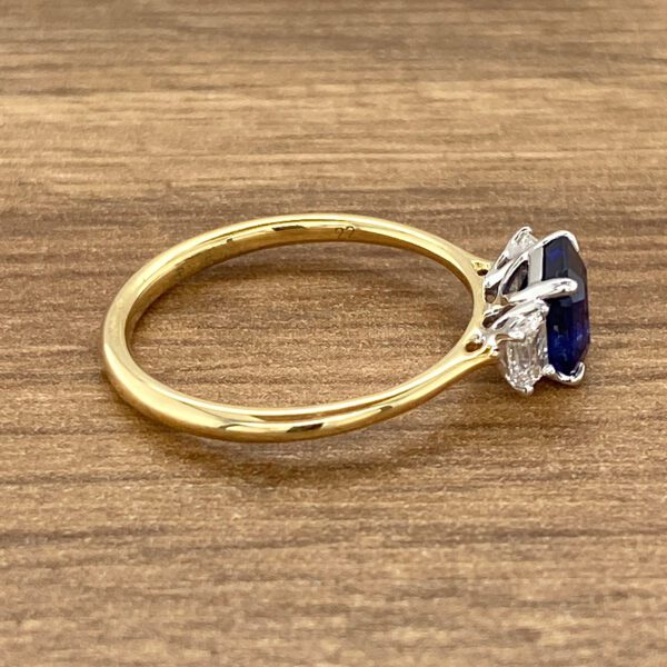 Gold ring with sapphire and diamonds.