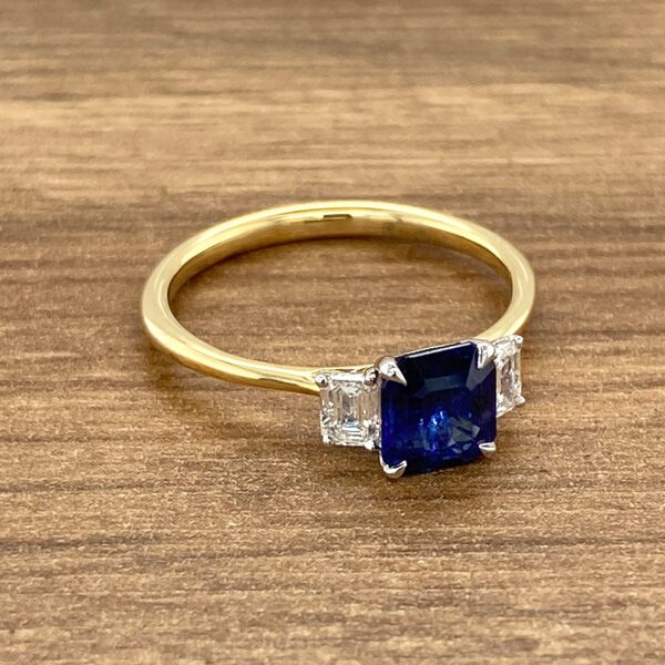Gold ring with sapphire and diamonds.