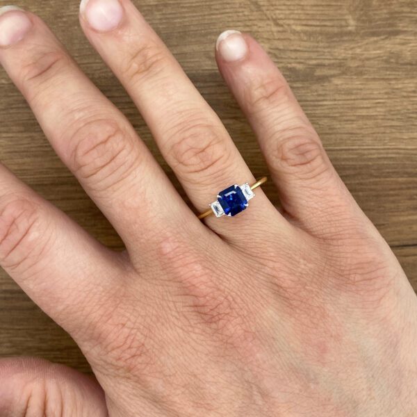 Gold ring with sapphire and diamonds.
