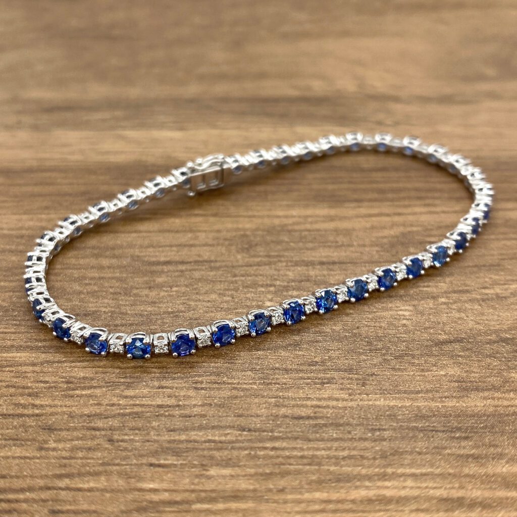 Elegant sapphire and diamond tennis bracelet.