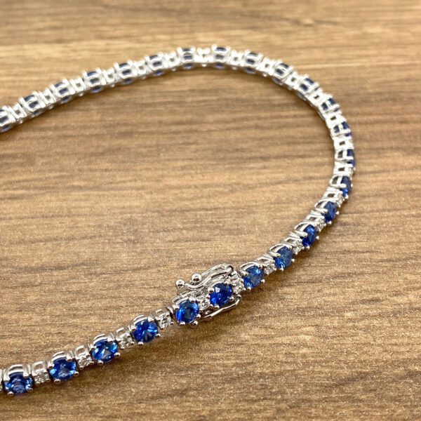 Blue sapphire and diamond tennis bracelet.