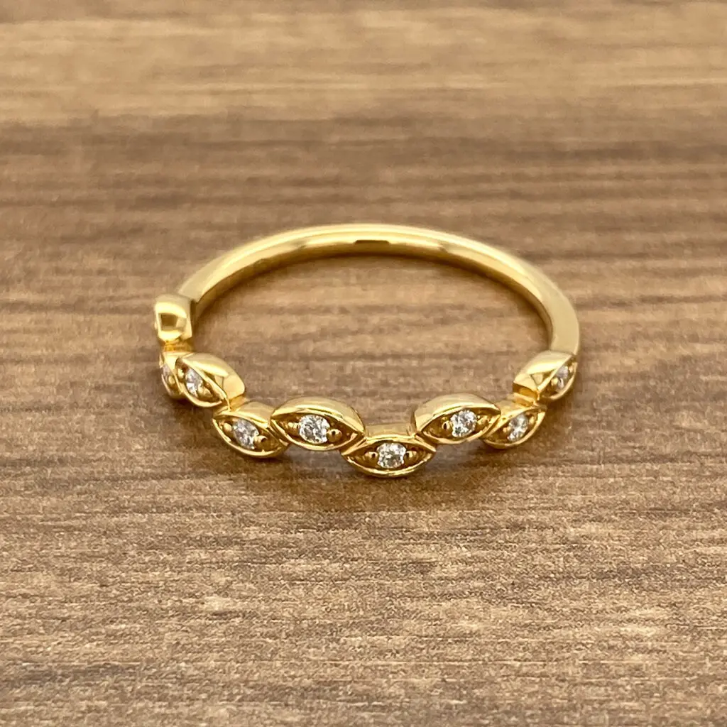 Gold ring with marquise diamond accents.