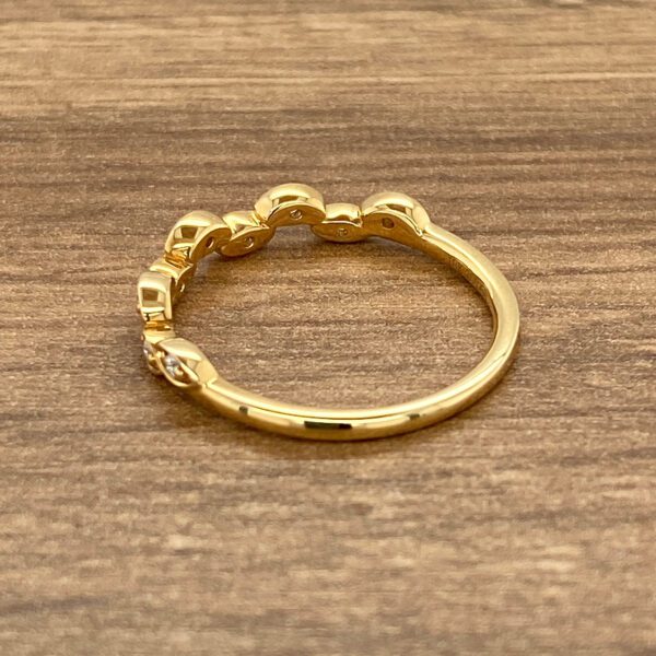 Gold ring with diamond accents.