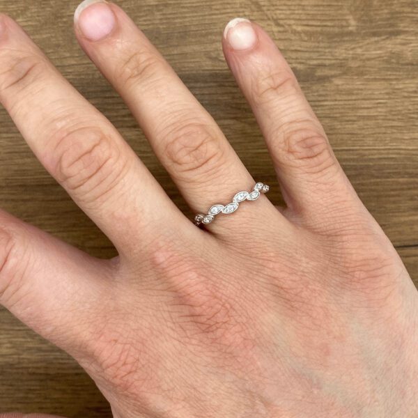 Diamond ring on a hand.