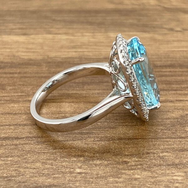 Aquamarine ring with diamond halo.