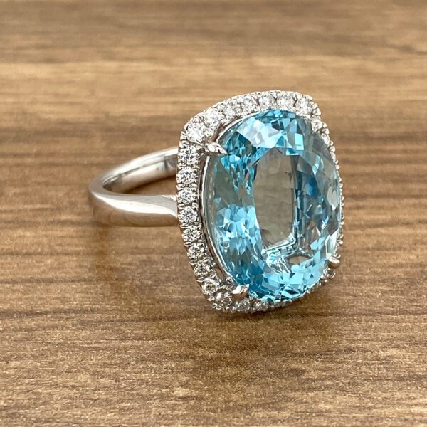 Aquamarine ring with diamond halo.