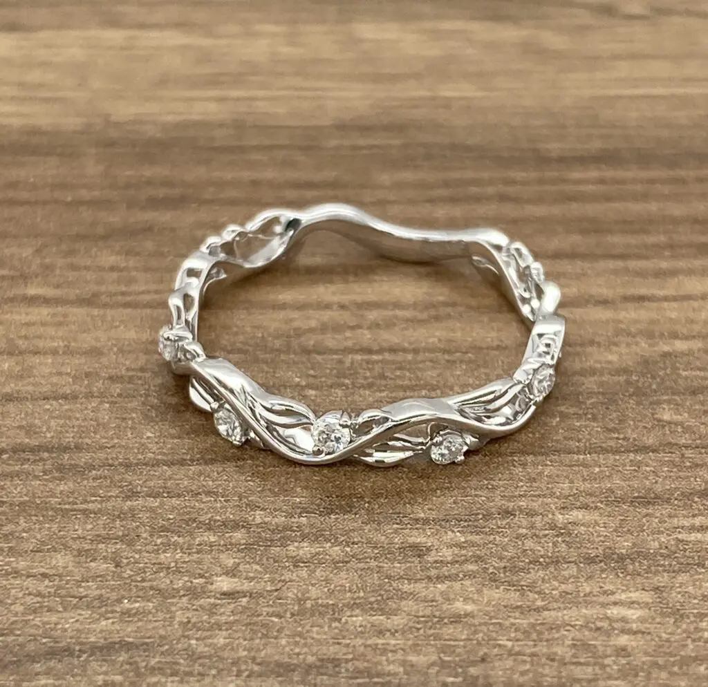 Here's an alt tag for the image: Delicate diamond vine ring.