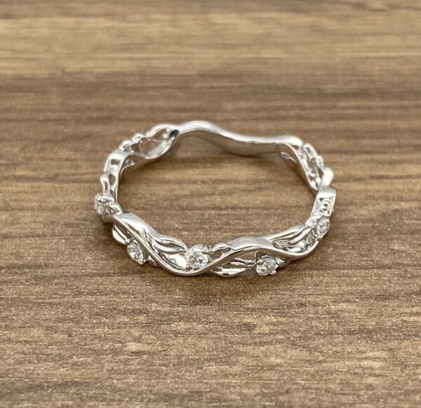 Here's an alt tag for the image: Delicate diamond vine ring.