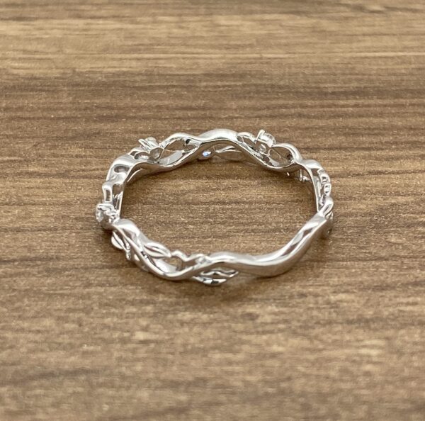 Delicate silver vine ring with gems.