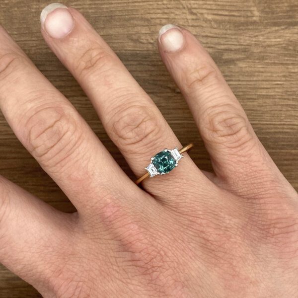Green sapphire and diamond ring.