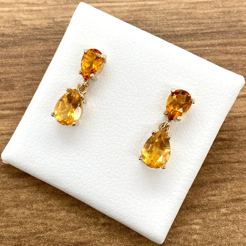 Golden teardrop gemstone earrings.