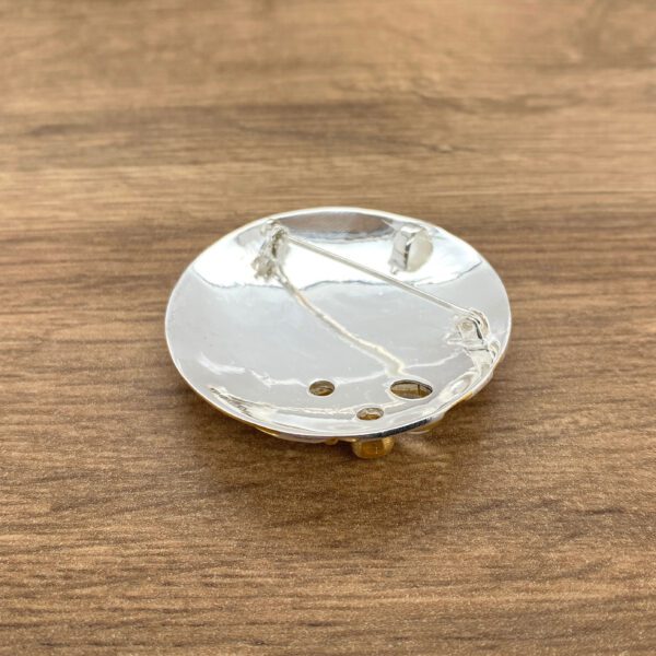 Round brooch back, silver and gold.