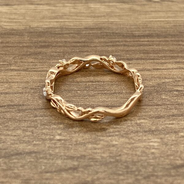 Rose gold vine ring with diamonds.