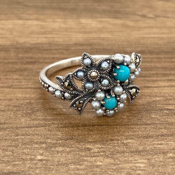 Sterling silver ring with turquoise and pearls.