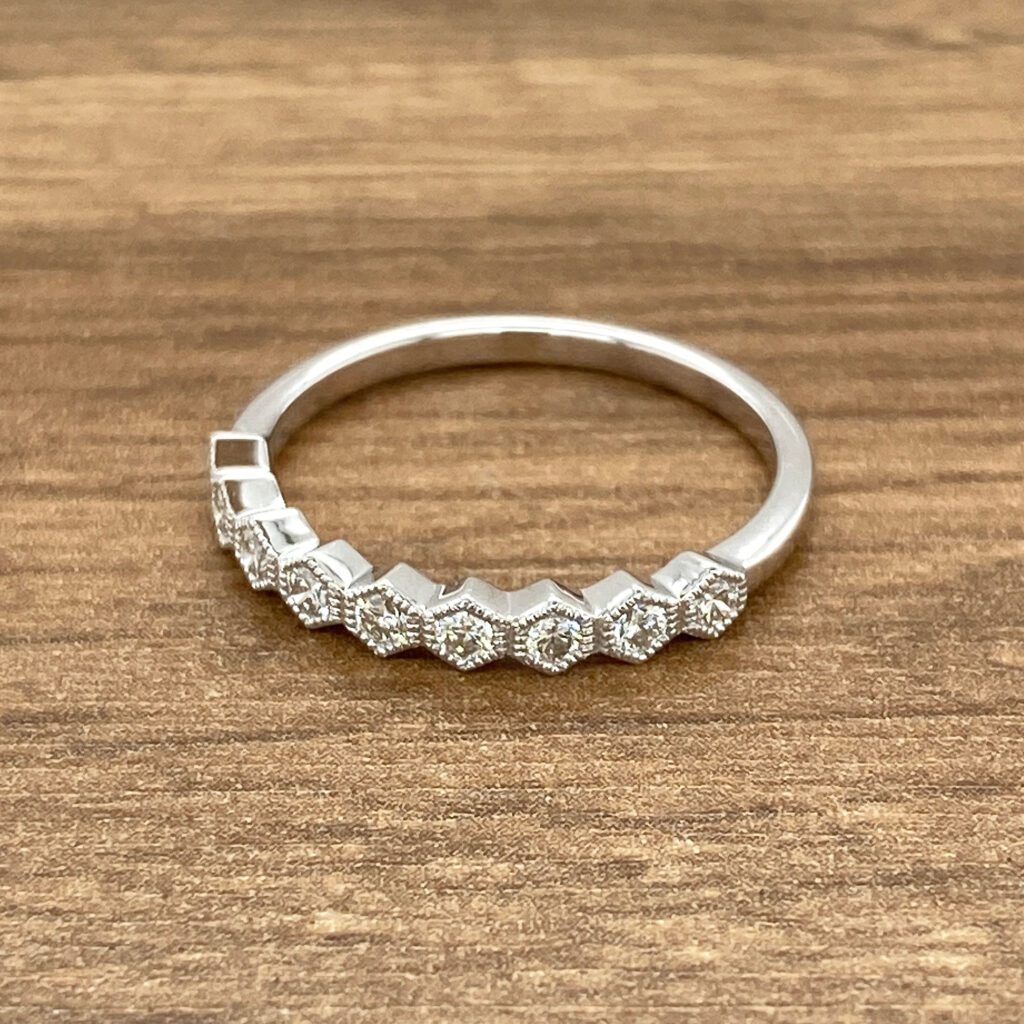 Diamond hexagon band ring in white gold.
