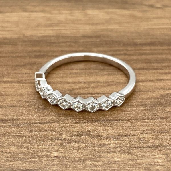 Diamond hexagon band ring in white gold.
