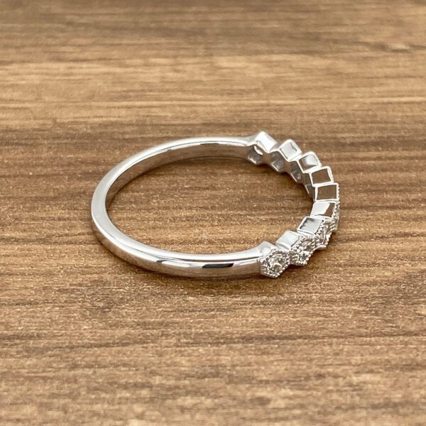 Diamond ring with geometric design.