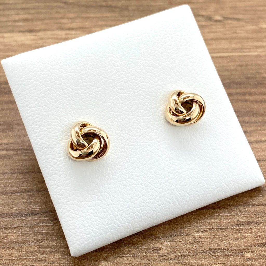 Gold knot stud earrings.