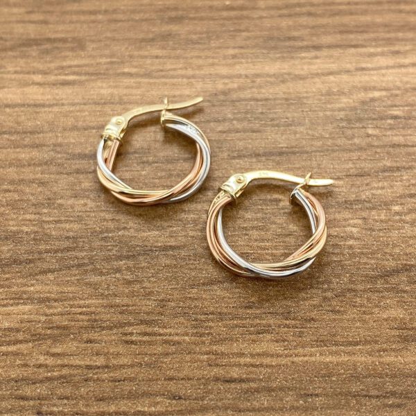Tri-gold twisted hoop earrings.