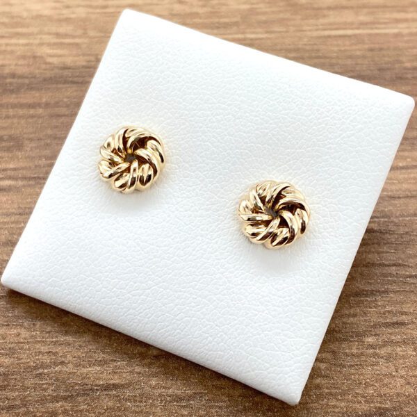 Gold knot stud earrings.
