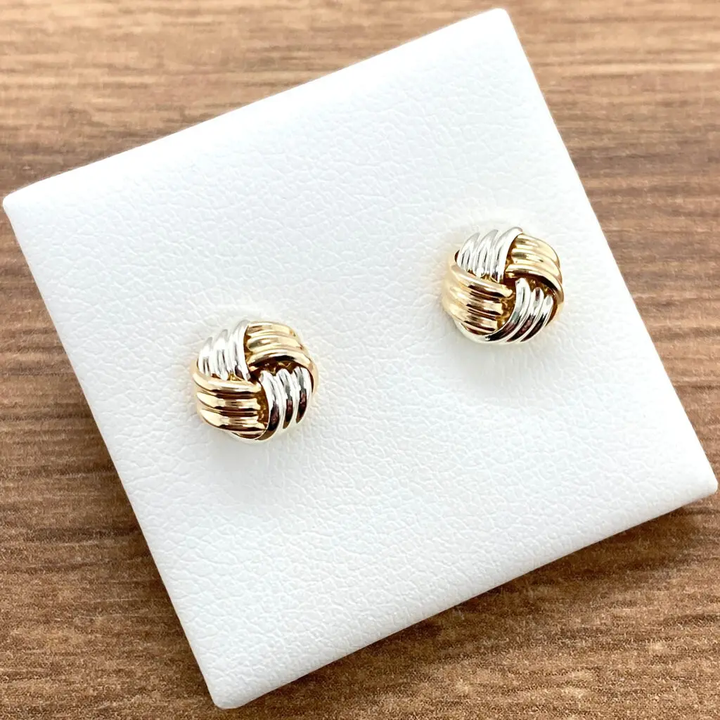 Two-toned gold knot earrings.
