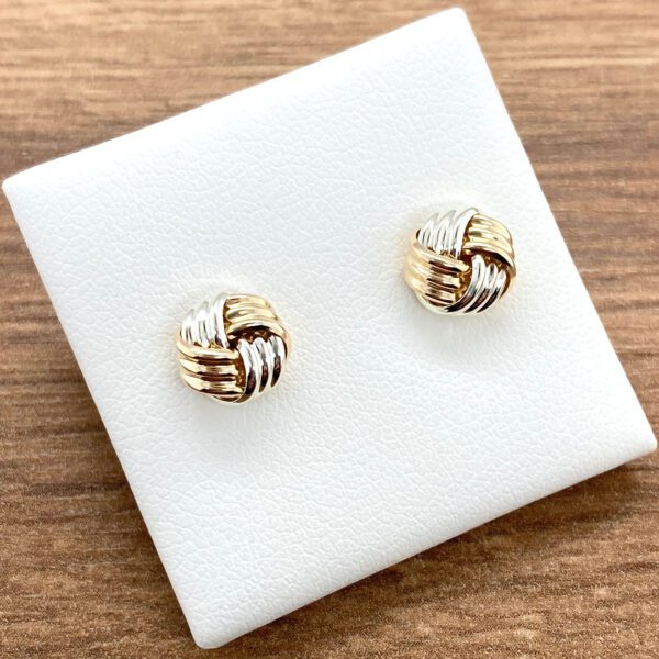 Two-toned gold knot earrings.