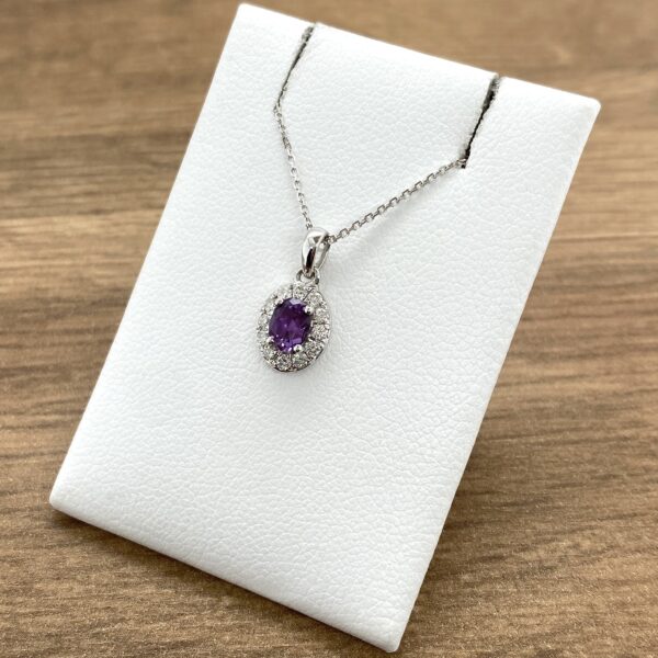 Amethyst and diamond pendant necklace.