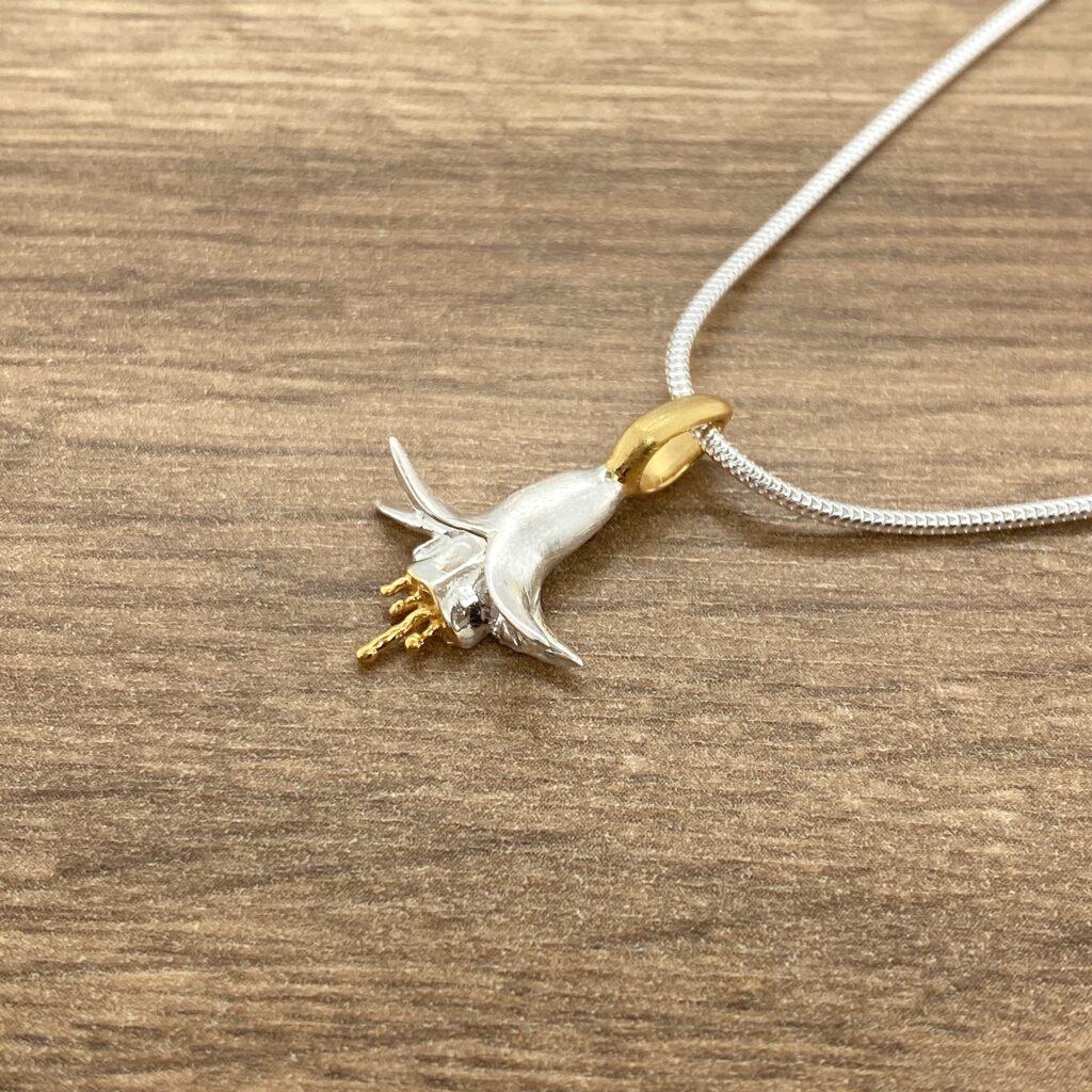 Silver and gold fuchsia flower pendant.