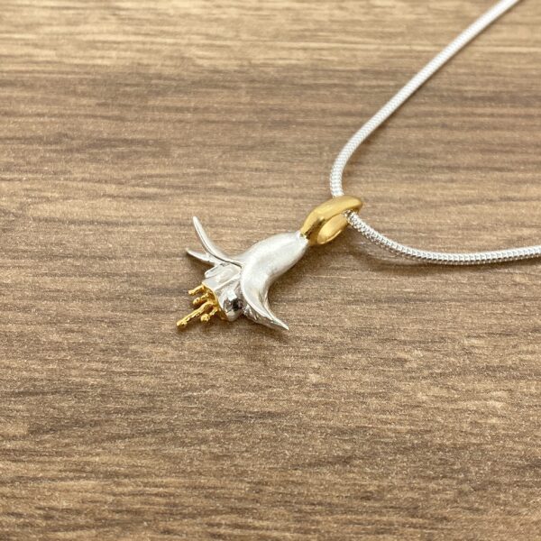 Silver and gold fuchsia flower pendant.