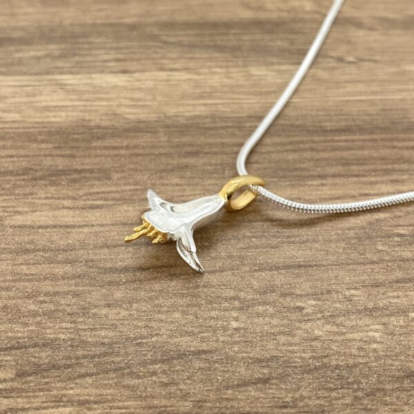 Silver and gold fuchsia flower pendant.