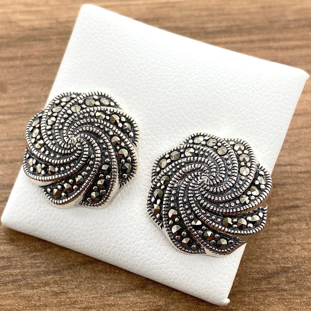 Silver marcasite swirl stud earrings.