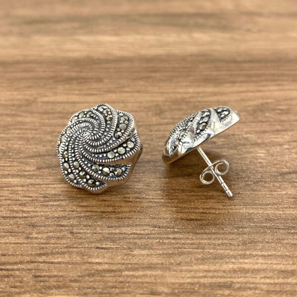Silver marcasite swirl stud earrings.