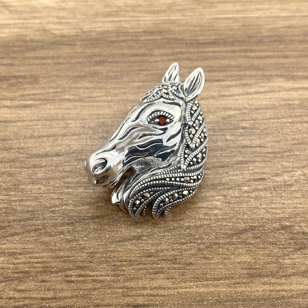 Silver horse head marcasite brooch.