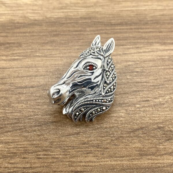 Silver horse head marcasite brooch.