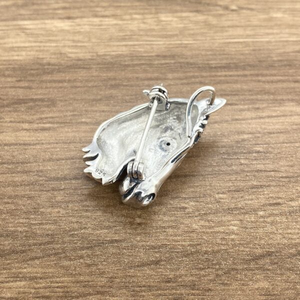 Sterling silver horse head brooch back.