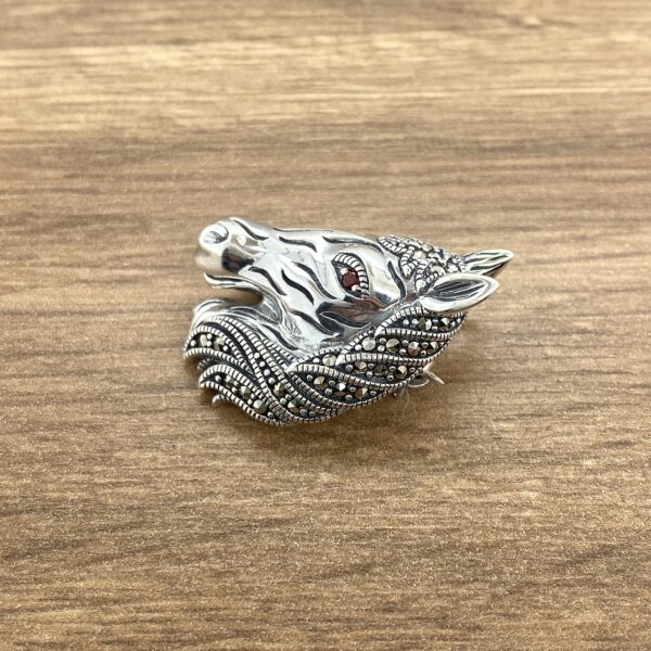 Silver marcasite horse head brooch.