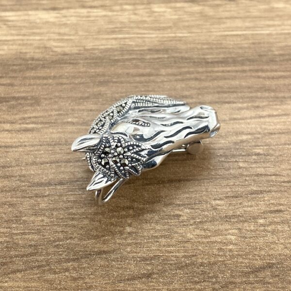 Silver horse head marcasite brooch.