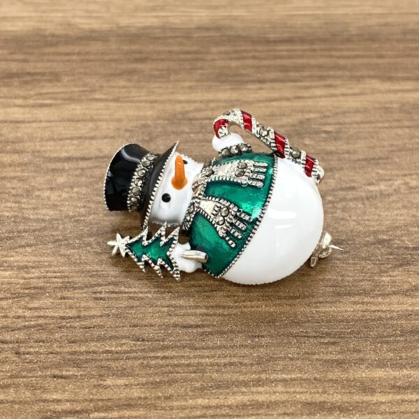 Here's an alt tag for the image: Charming snowman Christmas brooch.