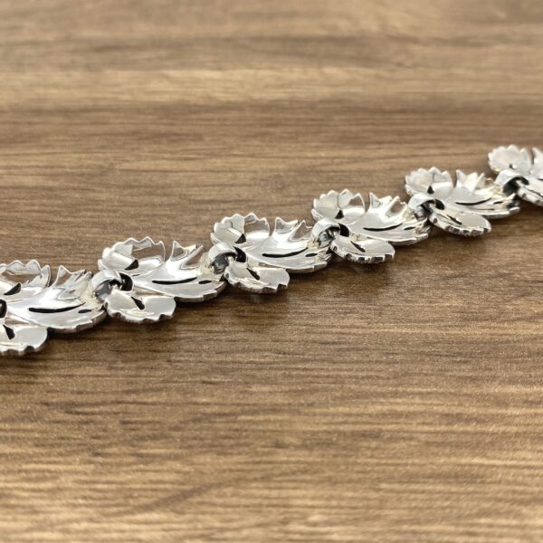 Silver leaf-shaped bracelet back view.