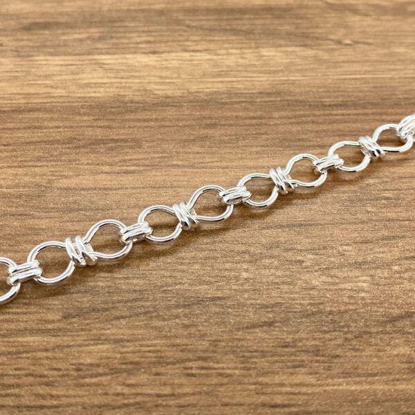 Silver infinity knot chain bracelet.